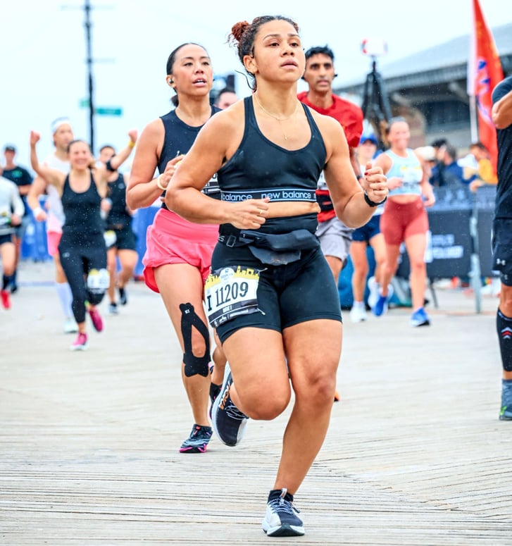 Runner Leesh Menard finishing the 2023 RBC Brooklyn Half on the boardwalk