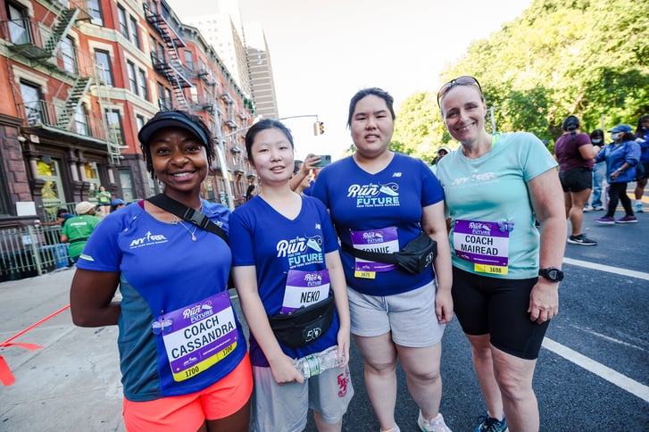 Coach Cassandra Smith and RFTF runners in Harlem
