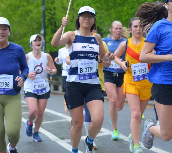 NYRR Pace Team member Shanshan Feng paces at a race.