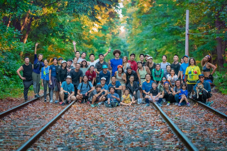 Asian Trail Mix runners on train tracks in Forest Park Queens