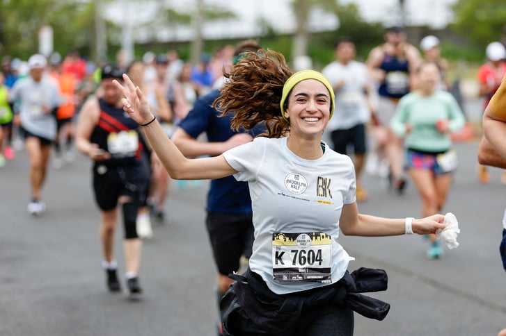 Smiling 2023 RBC Brooklyn Half runner wearing headband