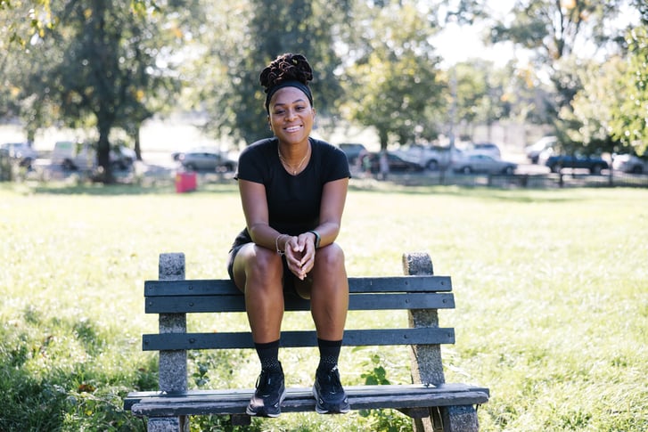Victoria Fortune sitting on a bench in Prospect Park