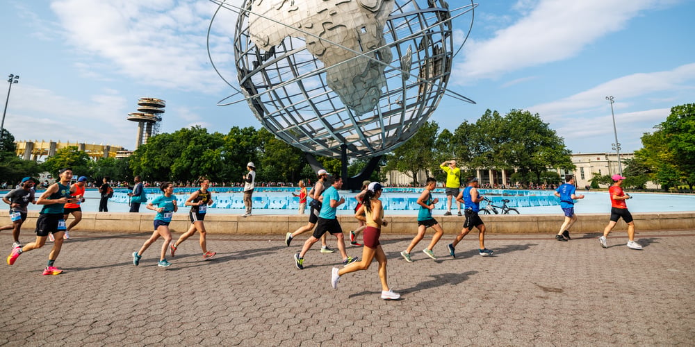 Runners in front of Unisphere at 2023 Queens 10K