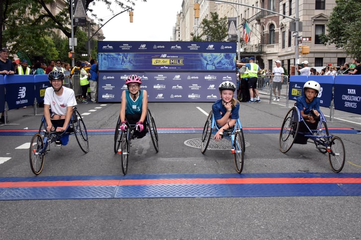 4 Youth wheelchair racers at 2016 NB 5th Avenue Mile starting line