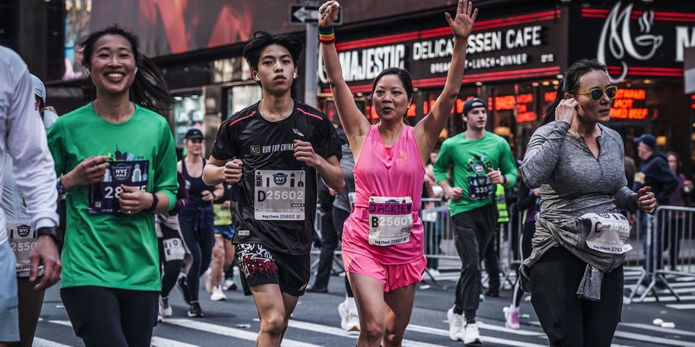 Runners Jackie Quan and Jefferson Lin in Times Square during 2024 United Airlines NYC Half