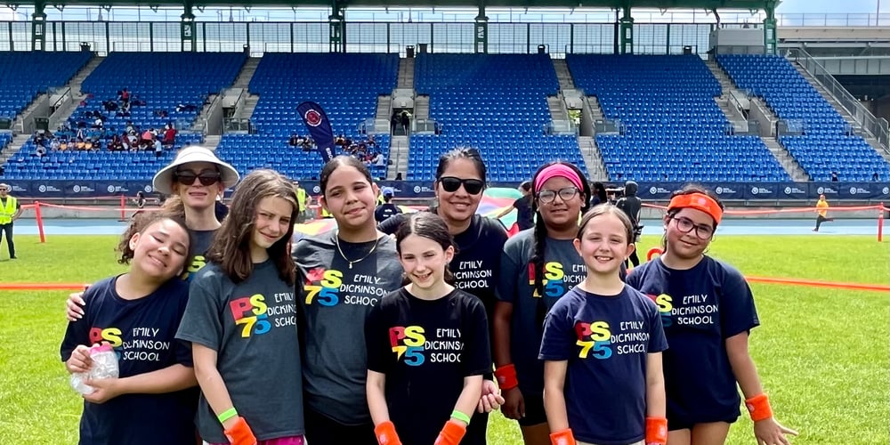 Keila Merino andPS 75 girls at Icahn Stadium on 2024 Global Running Day