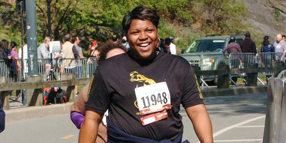 Shawanda Weems walking in a race in Central Park wearing Jaguars shirt