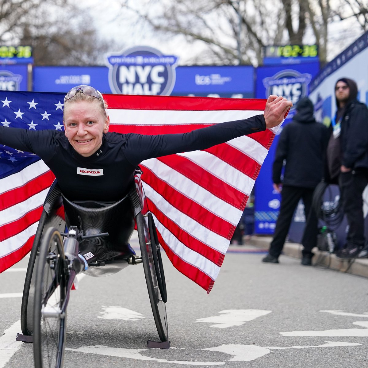 Susannah Scaroni with American flag at 2024 UA NYC Half