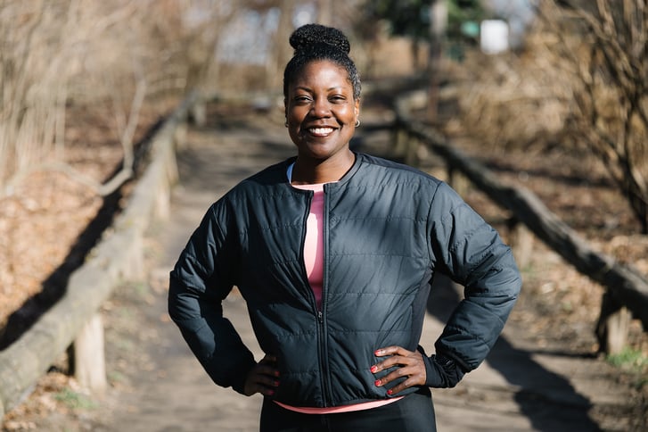 Cheryl Donald standing in running gear in Prospect Park