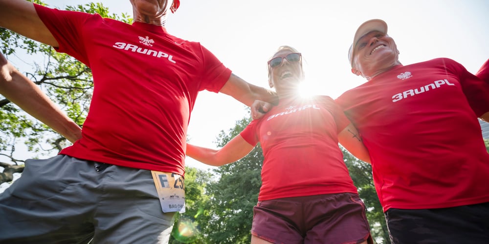 Runners with sunshine in background at 2024 NYRR Team Champs race
