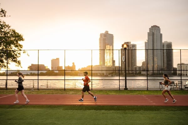 Runners at the East River track during Group Training.