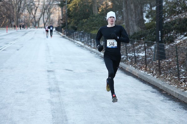 Runner in Central Park running a race in winter.