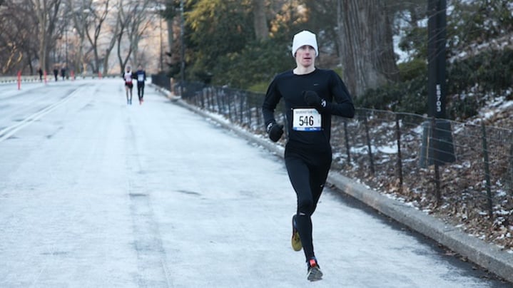 Runner in Central Park running a race in winter.