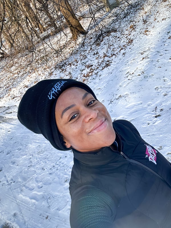 Victoria Fortune on a run in Prospect Park with snow in background