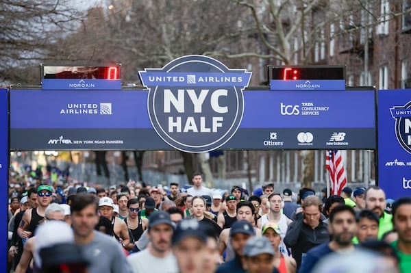 Running crossing the starting line of the United Airlines NYC Half.