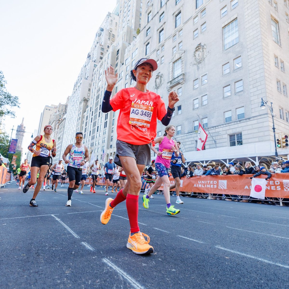 Runner waving to camera