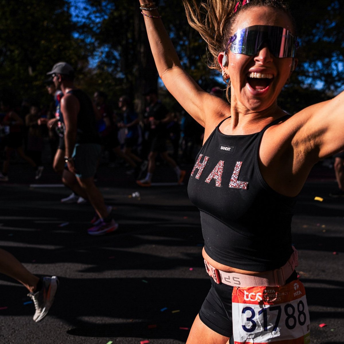 Runner with her arms up