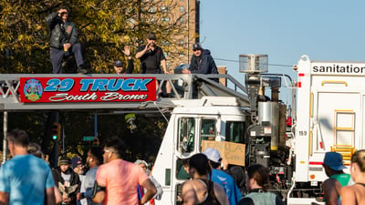 NYFD truck overlooking runners