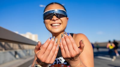 Runner showing off her NYCM nails