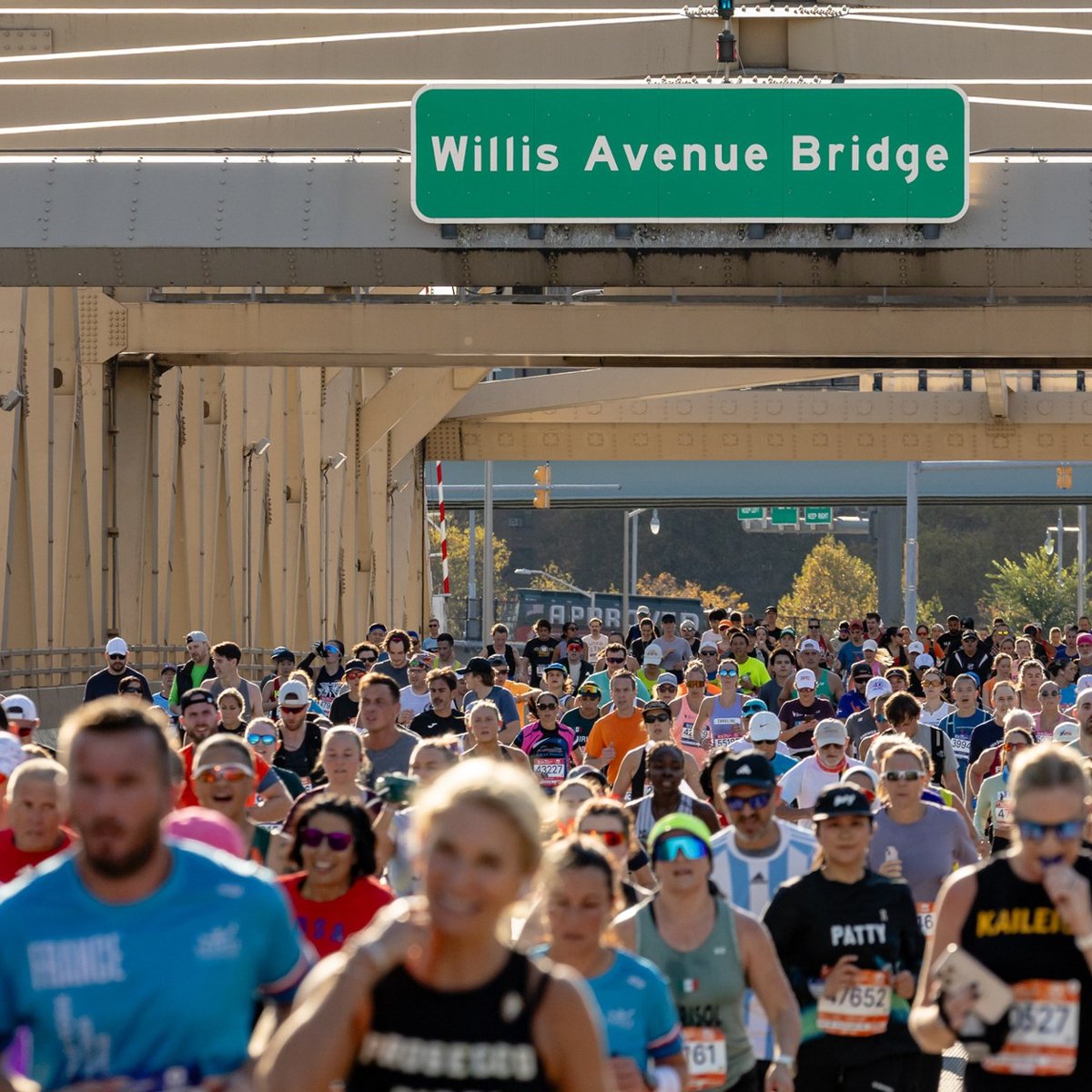 Runners under Willis Avenue Bridge