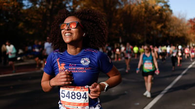 Runner smiling while running