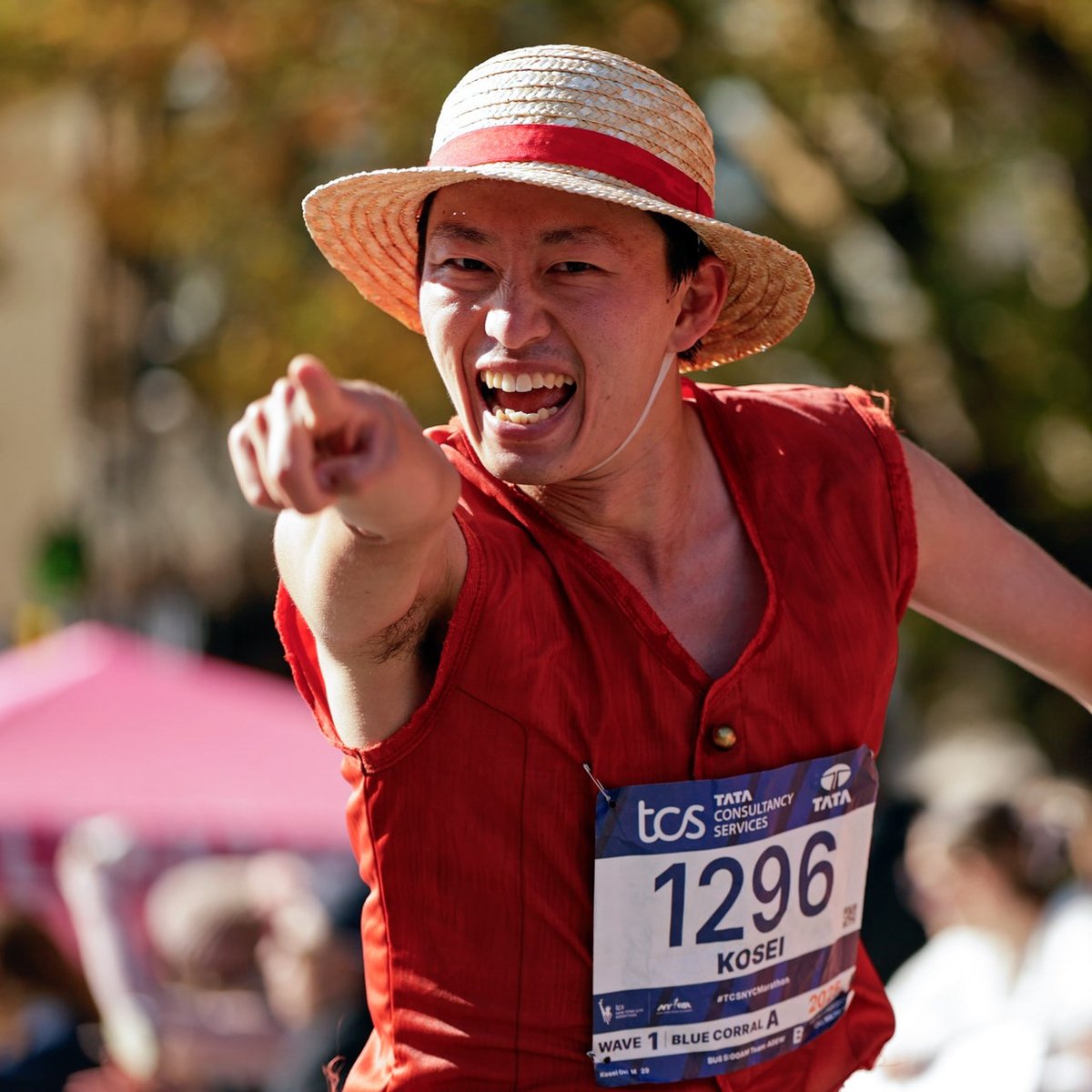 Runner pointing at camera