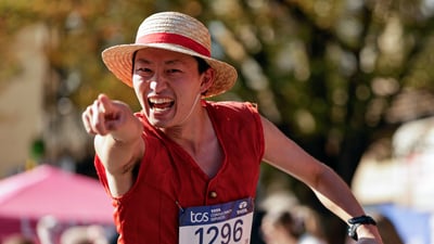 Runner pointing at camera
