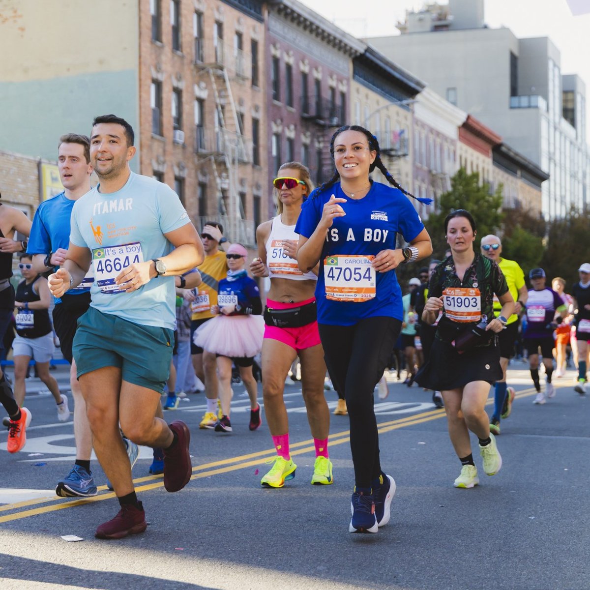 Runners smiling while running