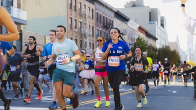 Runners smiling while running