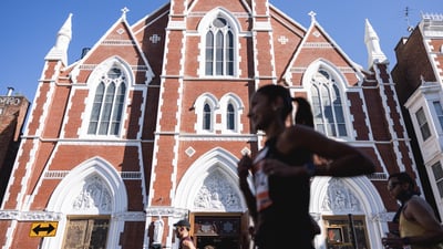 Runners in front of church