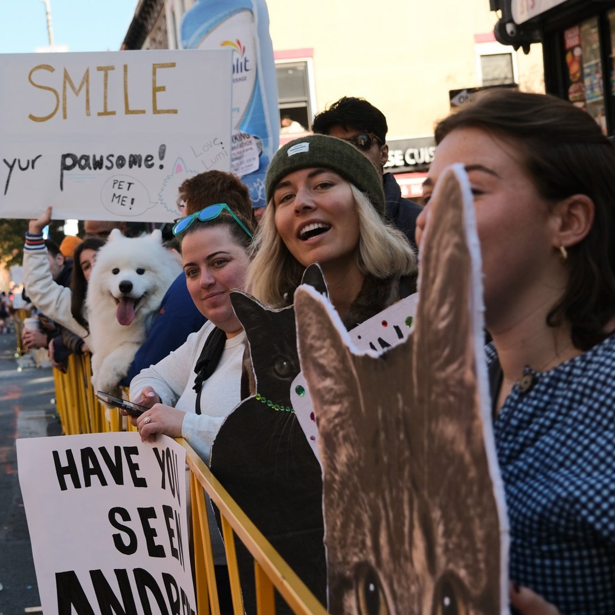Dog with owner and sign