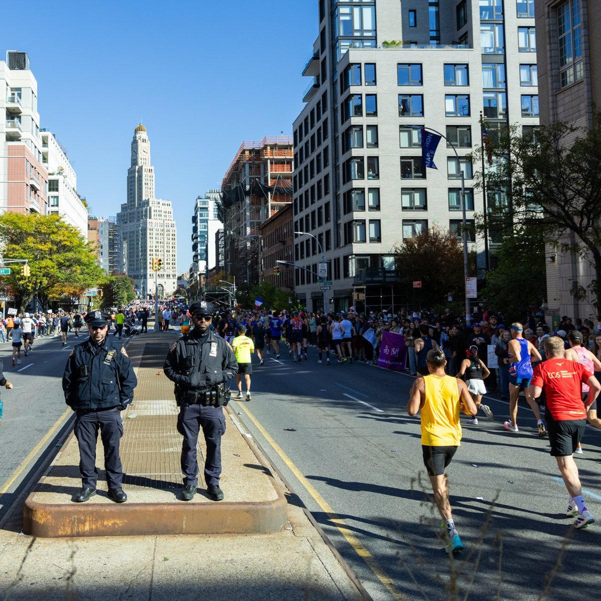Police officers watching runners