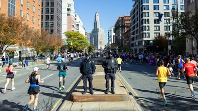 Police officers watching runners