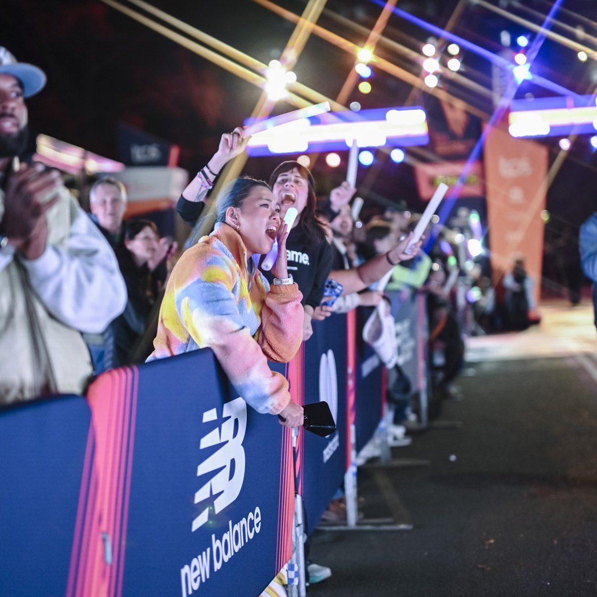 Spectators cheering on the final finishers