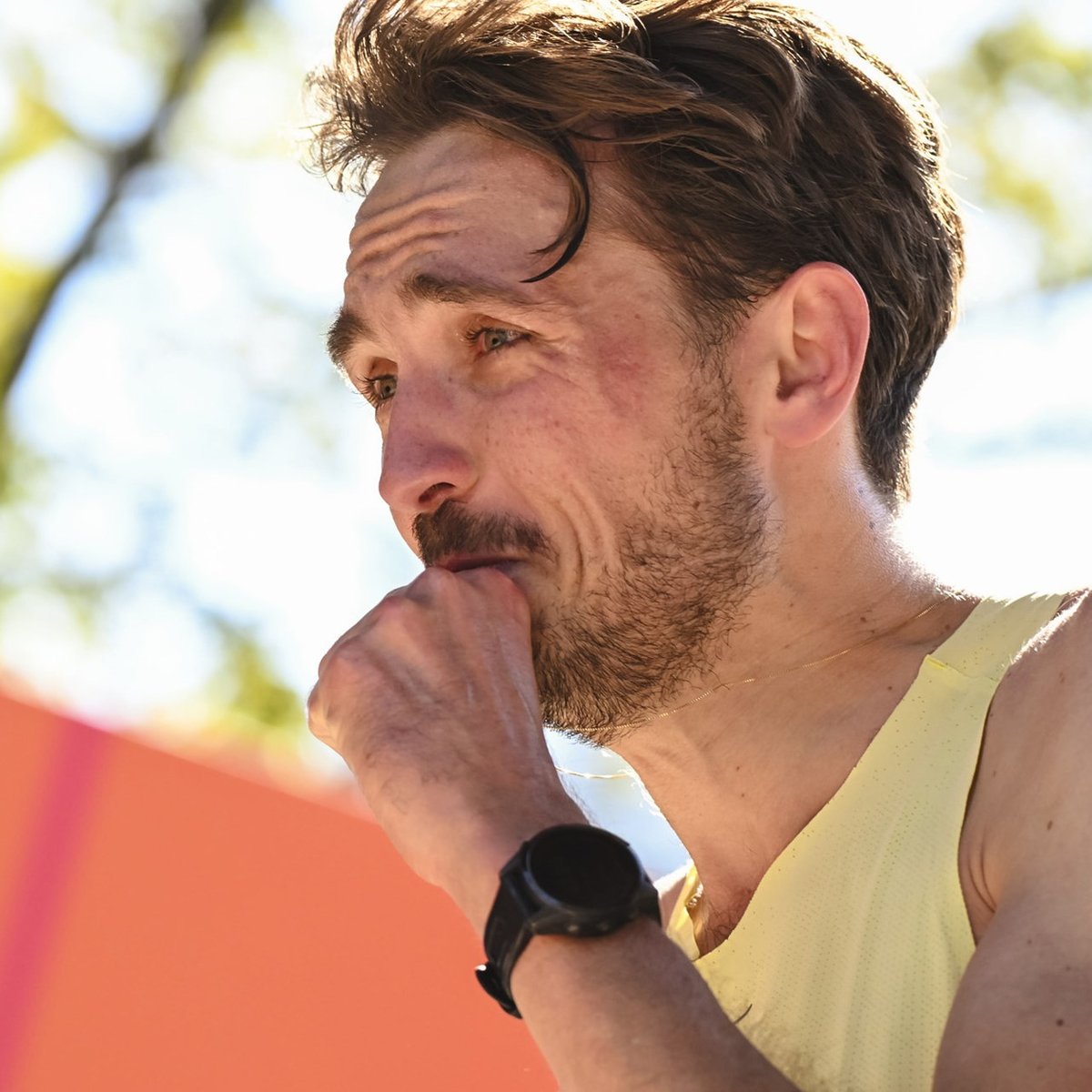 A close up shot of a man crying at the finish line of the TCS New York City Marathon