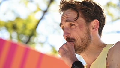 A close up shot of a man crying at the finish line of the TCS New York City Marathon
