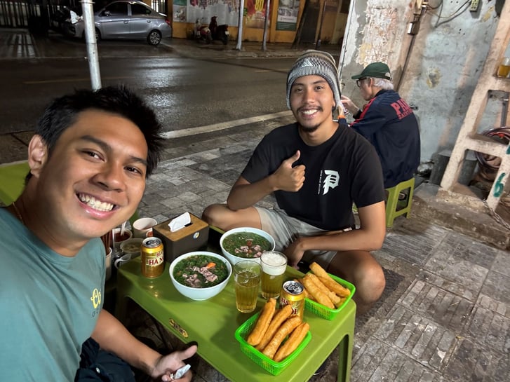 David in Vietnam with his cousin eating pho