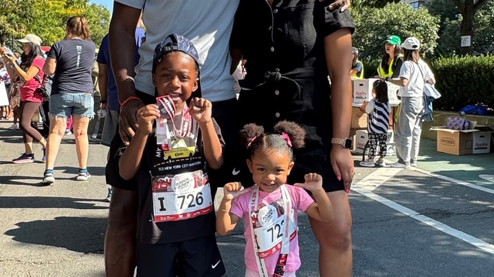 Rising NYRR dad Simon Obas and his family at the New Balance Bronx 10 Mile