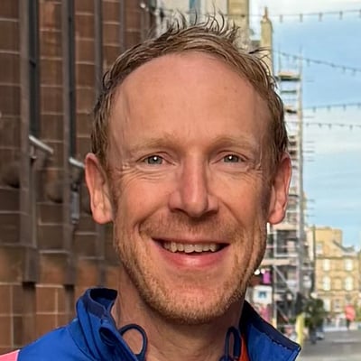 headshot of Giles Ashton-Roberts