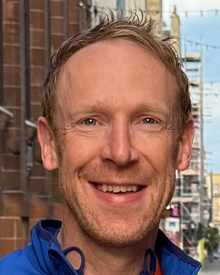 headshot of Giles Ashton-Roberts