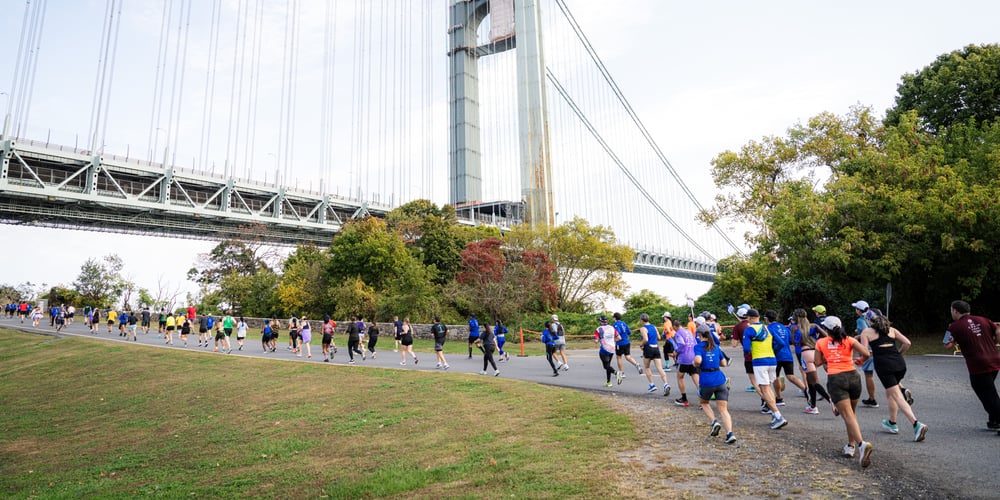Runners in the shadow of the Verrazzano-Narrows Bridge at the NYRR Staten Island Half