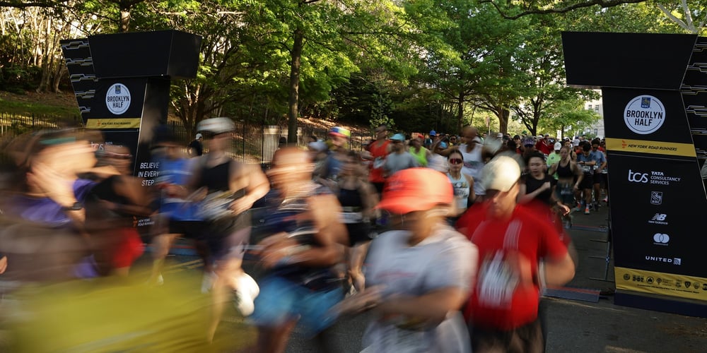 Start of 2026 RBC Brooklyn Half near Brooklyn Museum with blurred runners