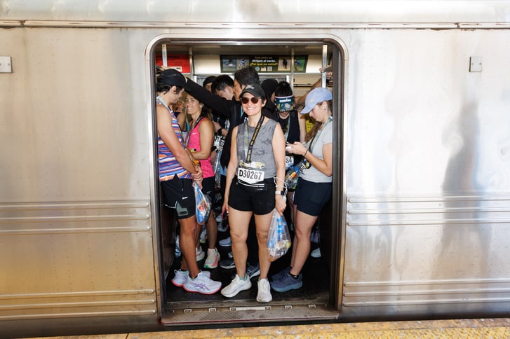 2026 RBC Brooklyn Half finishers on a subway car