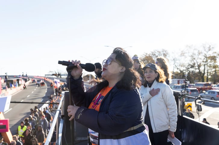 Teresa Hui singing the national anthem at the TCS New York City Marathon start.