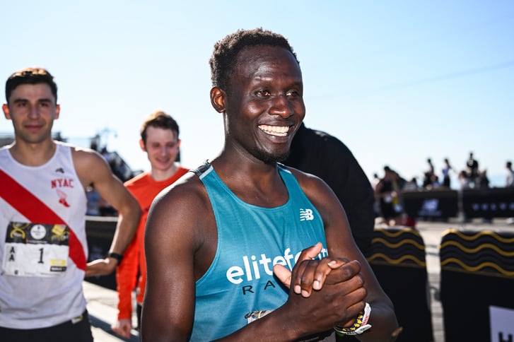 Abraham Longosiwa after winning the 2026 RBC Brooklyn Half on the Coney Island boardwalk.