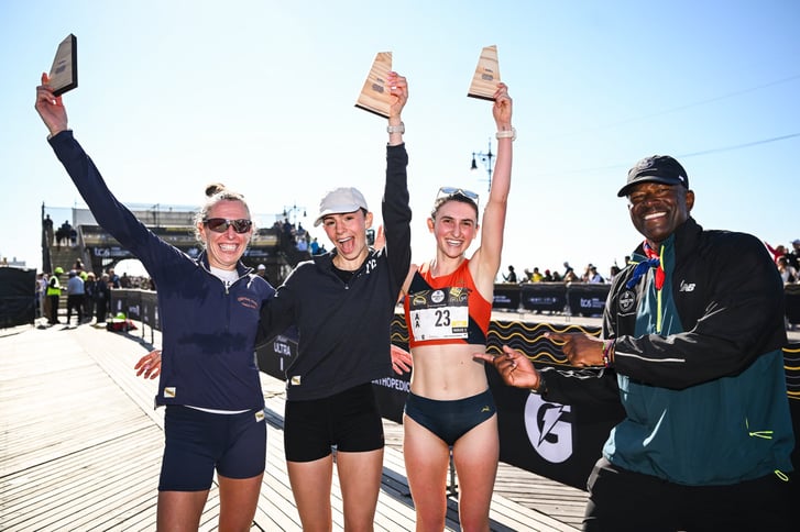 Roberta Groner, Fatima Alanis, Maddie Offstein, Ted Metellus after the 2026 RBC Brooklyn Half on the Coney Island boardwalk.