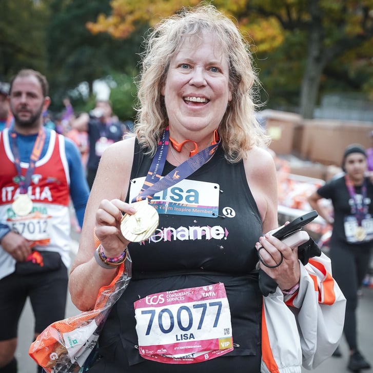 Lisa Swan after the 2025 TCS NYC Marathon with medal
