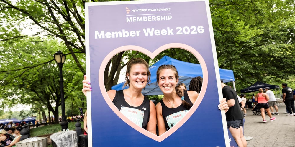Runners at Grete's Great Gallop holding up Member Week sign