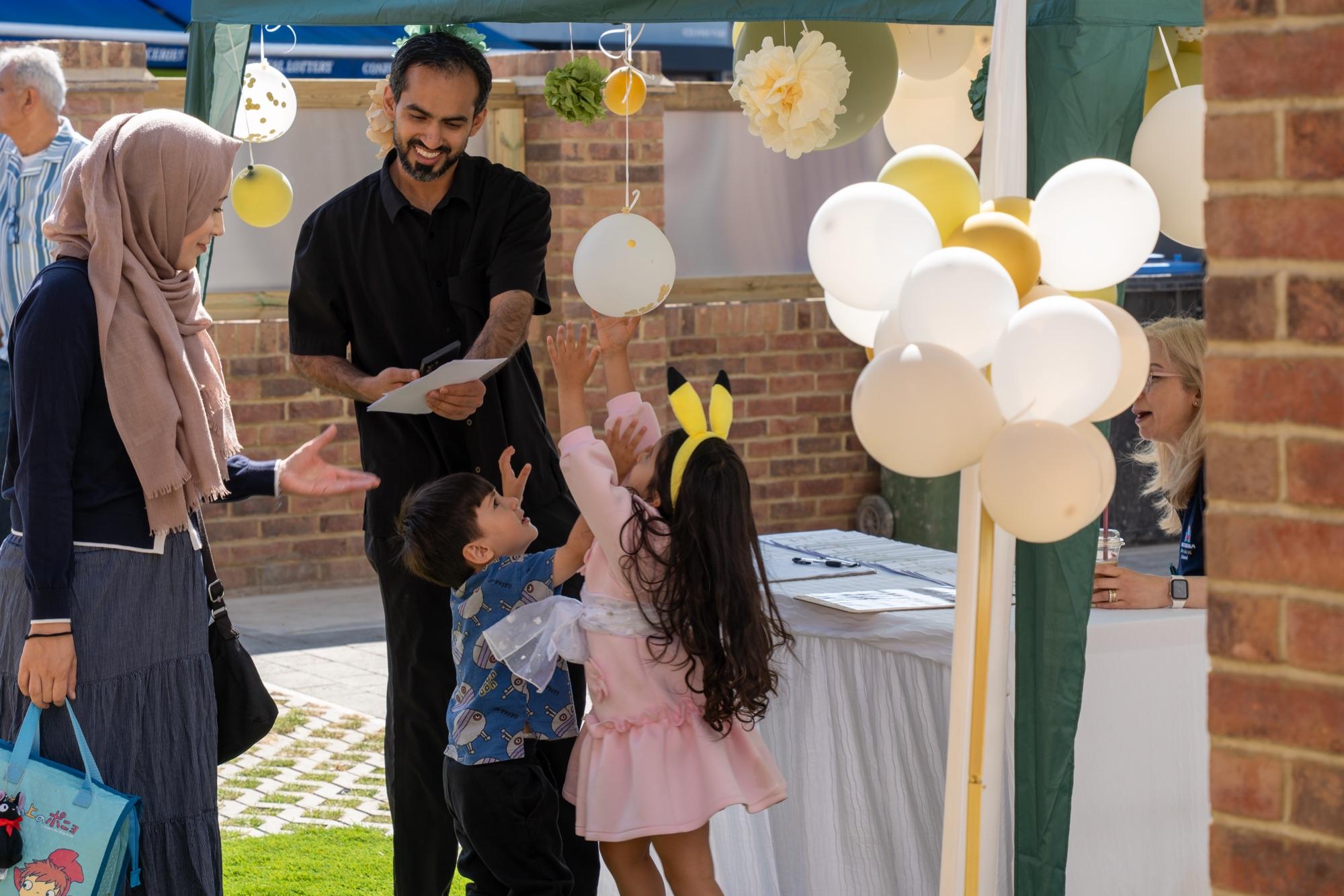 Families arriving and signing in at the Preston Road open day