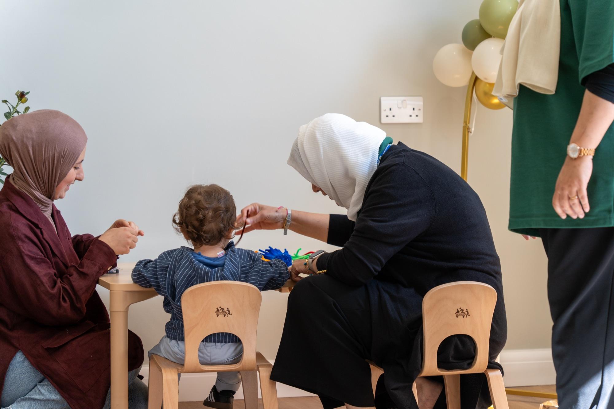 Small group work with a toddler at a low table